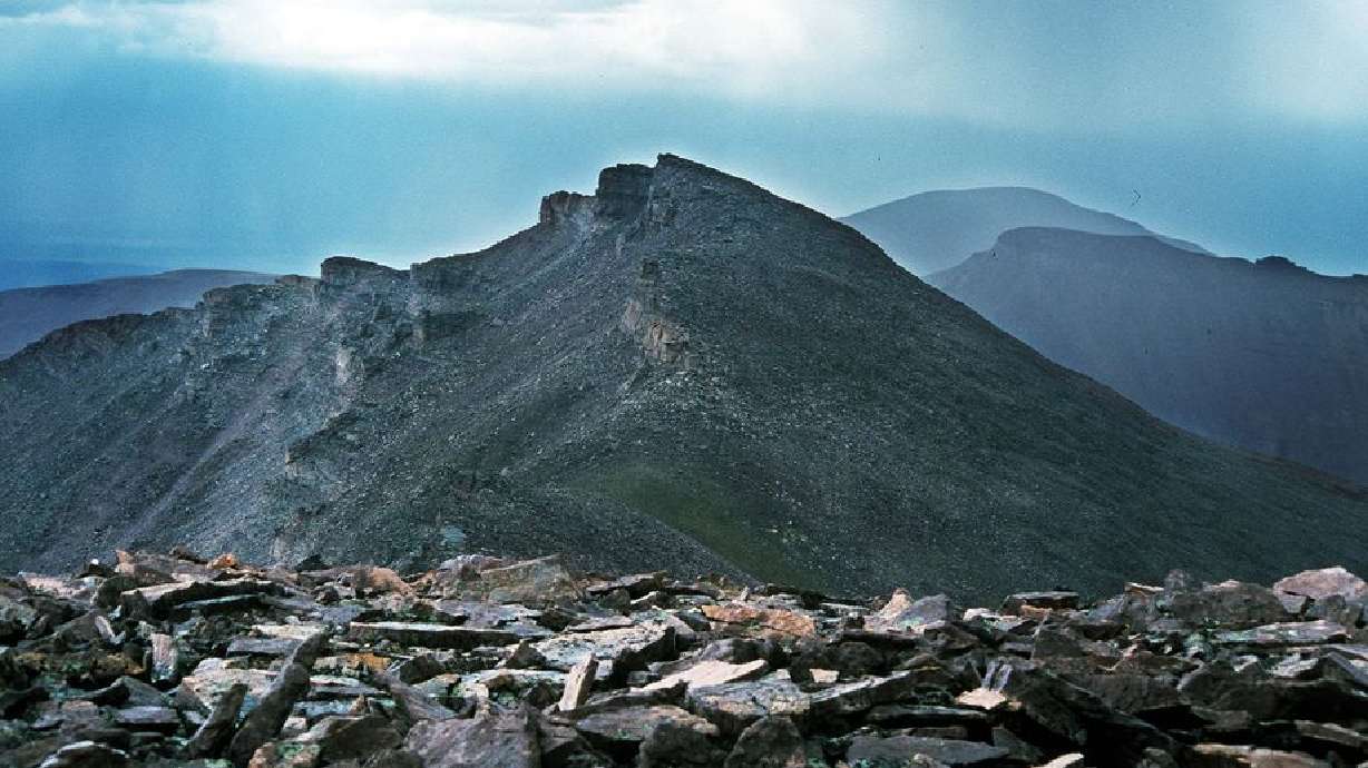 Hike to Kings Peak. Standing on South Kings Peak and looking north. At center is Kings Peak. Back right is Gilbert Peak. Lower ridge that slopes off to the right between Kings and Gilbert is Gunsight Peak. photo by Ravell Call, Aug. 15, 2000.