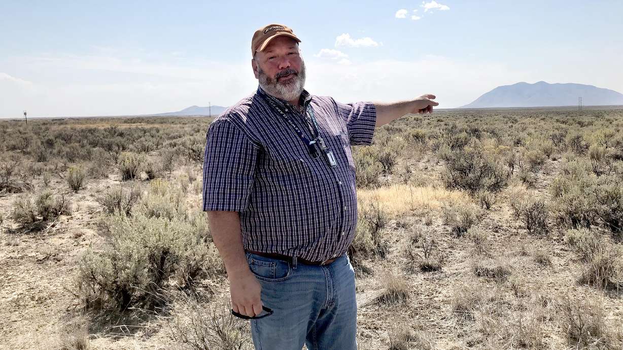 Don Miley, with the Idaho National Laboratory, gestures to a swath of land that may some day be home to the nation's first modular nuclear reactors. The NuScale Project is being pursued by the Utah Association of Municipal Providers to someday provide base load energy to multiple Utah cities. The laboratory is located about 35 miles west of Idaho Falls.
Don Miley, with the Idaho National Laboratory, gestures to a swath of land that may some day be home to the nation's first modular nuclear reactors. The NuScale Project is being pursued by the Utah Association of Municipal Providers to someday provide base load energy to multiple Utah cities. The laboratory is located about 35 miles west of Idaho Falls.