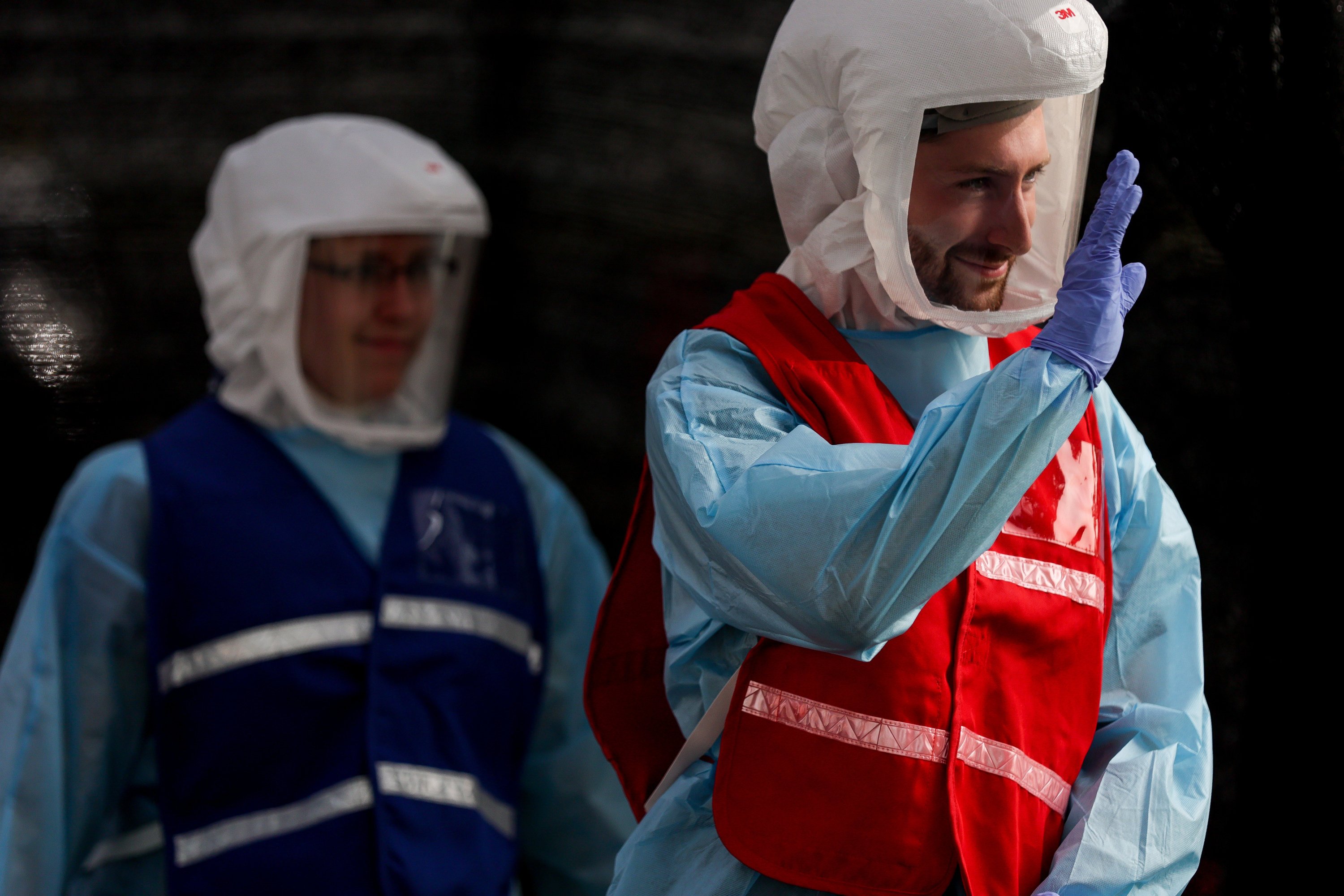 Seth Christensen waves goodbye after administering a COVID-19 test at a testing site run by the Salt Lake County Health Department at Glendale Middle School in Salt Lake City on Tuesday, Sept. 15, 2020.