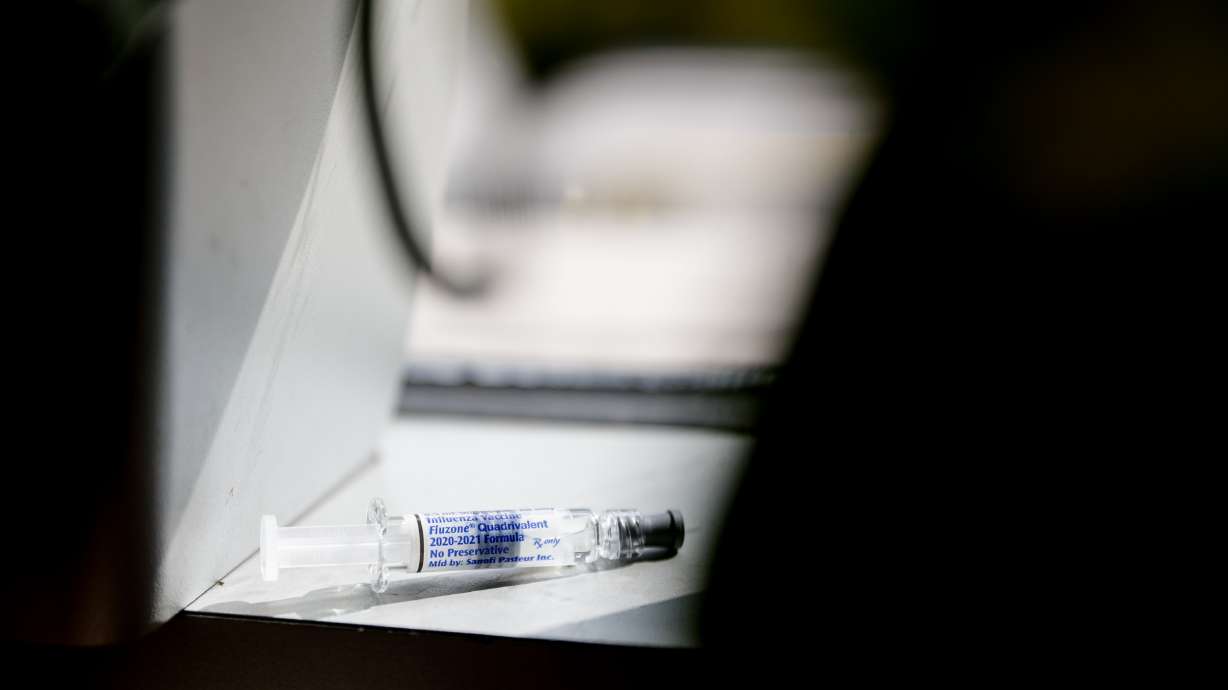 A dose of Fluzone Quadrivalent influenza vaccine, manufactured by Sanofi Pasteur, is pictured at the Harmons City Creek pharmacy in Salt Lake City on Tuesday, Sept. 15, 2020.
