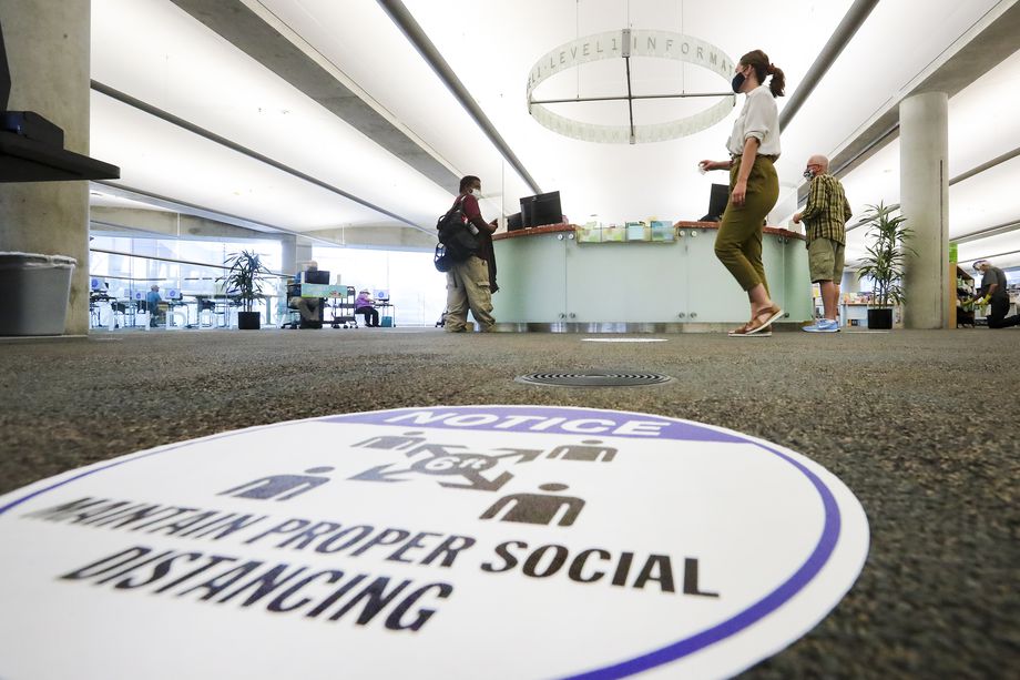 Patrons visit the Main Library in Salt Lake City on Monday, Sept. 21, 2020. All branches of the Salt Lake City Public Library reopened Monday for express services, which include 30-minute computer sessions, access to fax/copy machines, holds pickup, item return and reference assistance.