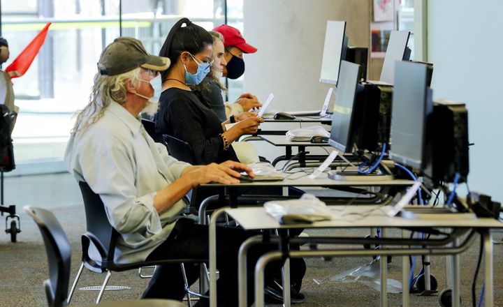 Patrons use computers at the Main Library in Salt Lake City on Monday, Sept. 21, 2020.