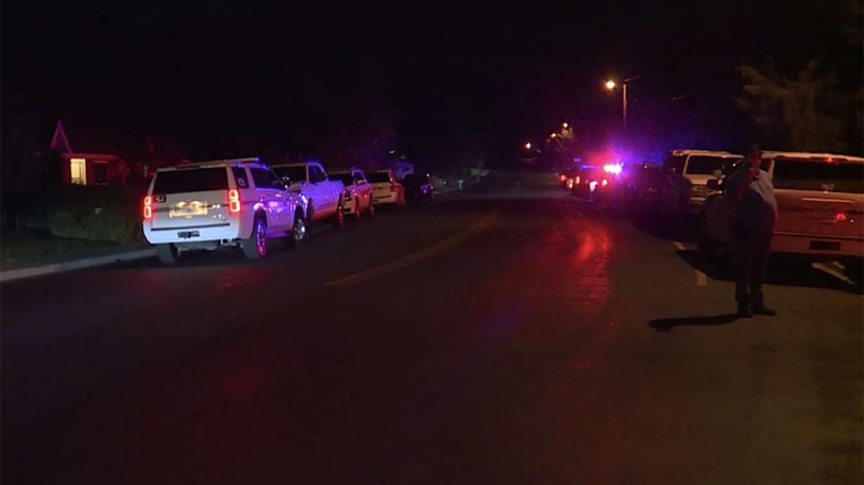 Police respond to a neighborhood in Cedar Hills on Thursday, Sept. 24, 2020, where they ultimately arrested a couple who they say owe $1 million in taxes and have been illegally living in their former home.