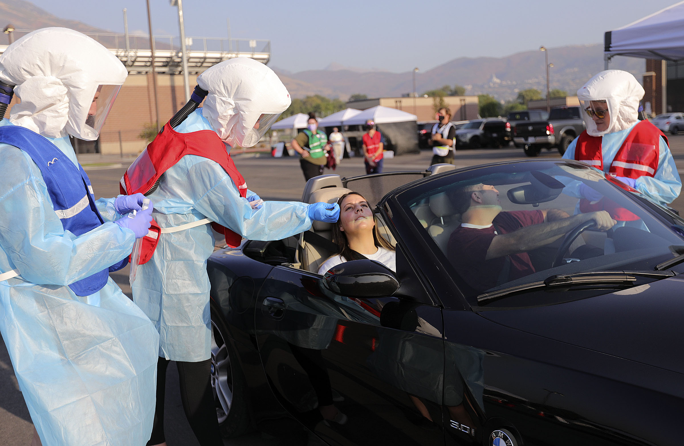 Corner Canyon sophomore Megan Anselmo and her father Matt Anselmo get tested for COVID-19 outside of Corner Canyon High School in Draper on Monday, Sept. 21, 2020. The Salt Lake County Health Department will be offering COVID-19 testing at Corner Canyon High School again on Monday, Sept. 28, from 4 p.m. to 7 p.m.