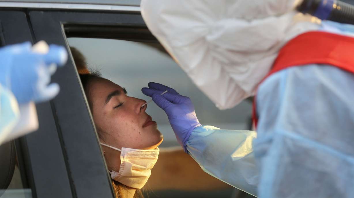Deseret Miller, UVU sophomore, gets tested for COVID-19 outside of Corner Canyon High School in Draper on Monday, Sept. 21, 2020. The Salt Lake County Health Department will be offering COVID-19 testing at Corner Canyon High School again on Monday, Sept. 28, from 4 p.m. to 7 p.m.