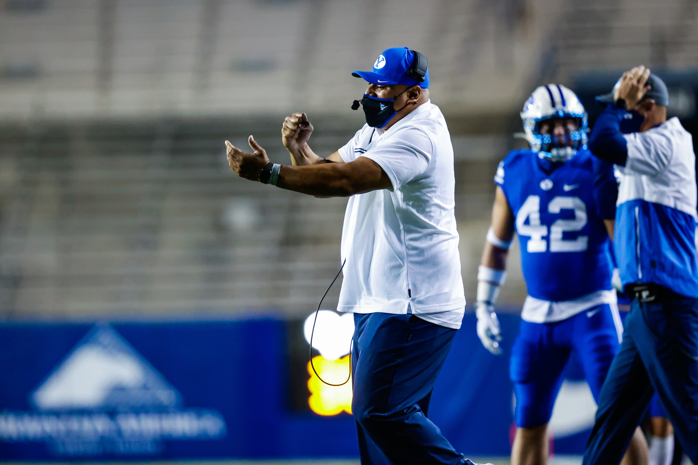 BYU coach Kalani Sitake signals from the sideline during the Cougars' NCAA college football game against Troy, Saturday, Sept. 22, 2020 in Provo, Utah.
