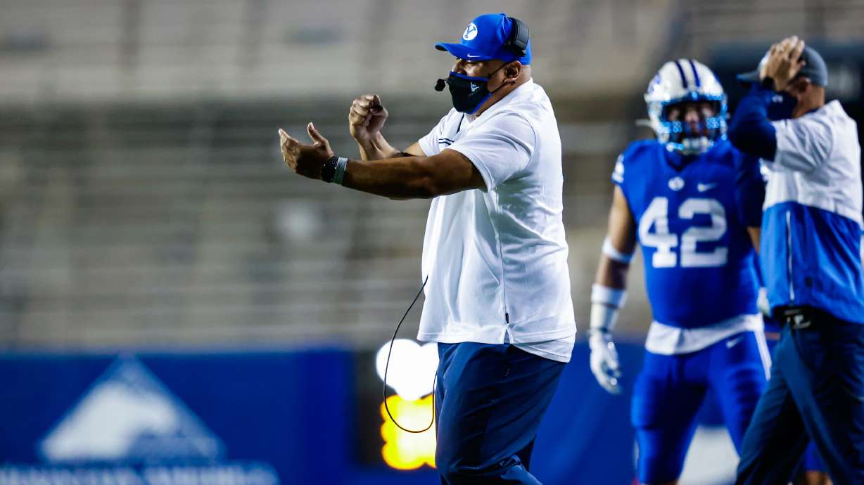 BYU coach Kalani Sitake signals from the sideline during the Cougars' NCAA college football game against Troy, Saturday, Sept. 22, 2020 in Provo, Utah.
