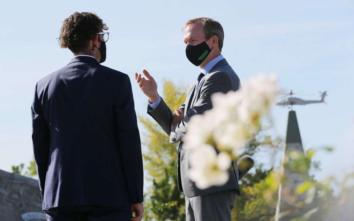 Veteran Chris Goehner, left, talks with Rep. Ben McAdams, D-Utah, after a press conference at the Military Services Monument in West Jordan’s Veterans Memorial Park on Monday, Sept. 28, 2020. During the press conference, McAdams discussed his bipartisan bill to prevent veteran suicides. The bill, which studies the connection between living in high-altitudes and rates of suicide, passed in the House and will now go to the president for his signature.