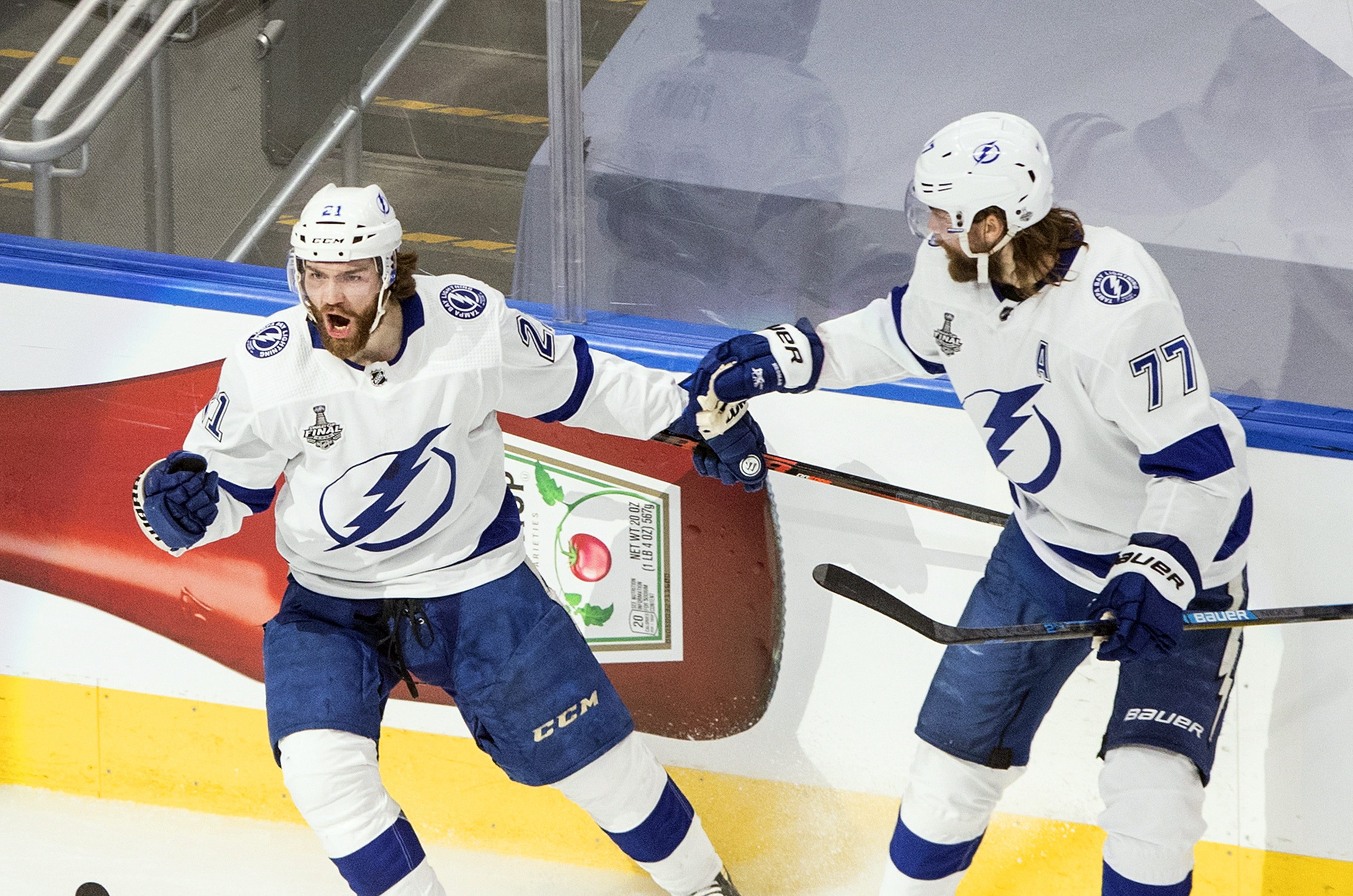 Tampa Bay Lightning's Brayden Point (21) celebrates his goal against the Dallas Stars with Victor Hedman (77) during first-period NHL Stanley Cup finals hockey game action in Edmonton, Alberta, Monday, Sept. 28, 2020.