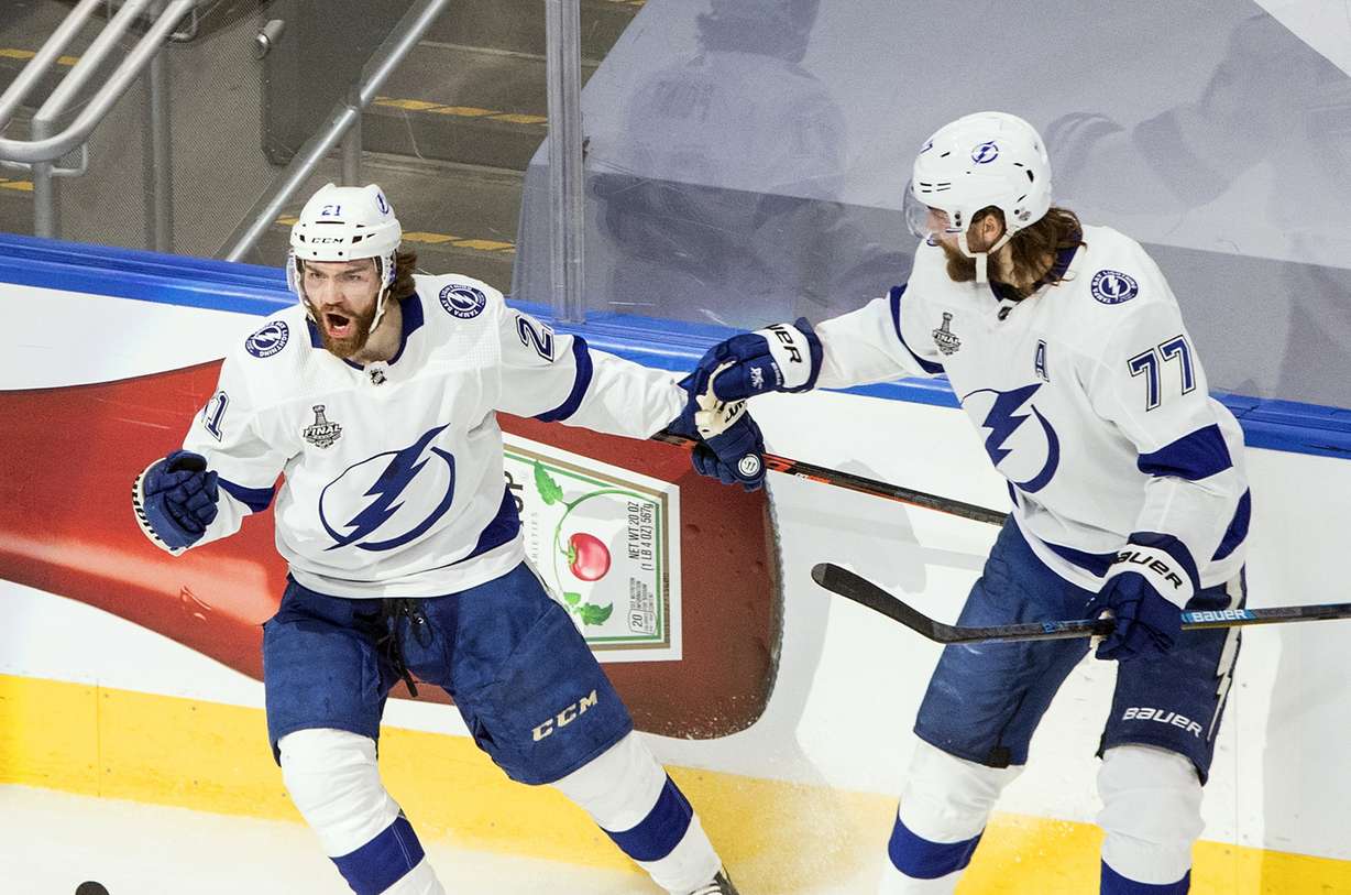 Tampa Bay Lightning's Brayden Point (21) celebrates his goal against the Dallas Stars with Victor Hedman (77) during first-period NHL Stanley Cup finals hockey game action in Edmonton, Alberta, Monday, Sept. 28, 2020.
