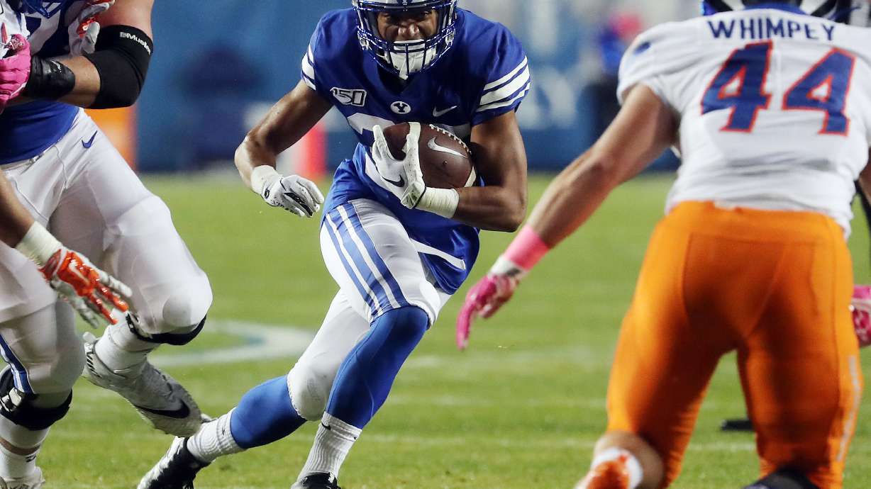 Brigham Young Cougars running back Sione Finau runs the ball against the Boise State Broncos during an NCAA football game in Provo on Saturday, Oct. 19, 2019.