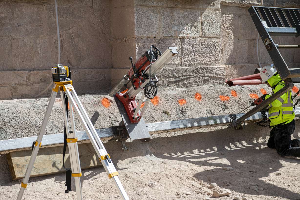 A photo of equipment that precisely calculates and lines up a machine that drills holes at different angles into the foundation of the Salt Lake Temple taken in June 2020.