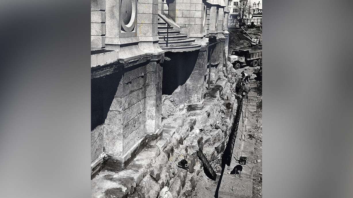 The depth and strength of the Salt Lake Temple foundation, 30 feet deep, is exposed by excavators. March 30, 1963.
