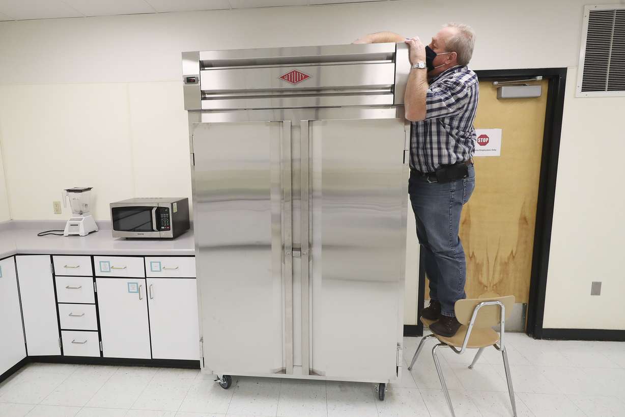 Layton High School facilities coordinator Rod Southam adjusts the temperature of a refrigerator at the school in Layton on Tuesday, Sept. 29, 2020. Southam is the winner of the national U.S. Department of Education RISE award, which honors classified school employees who exemplify excellence in work performance, leadership and community involvement.