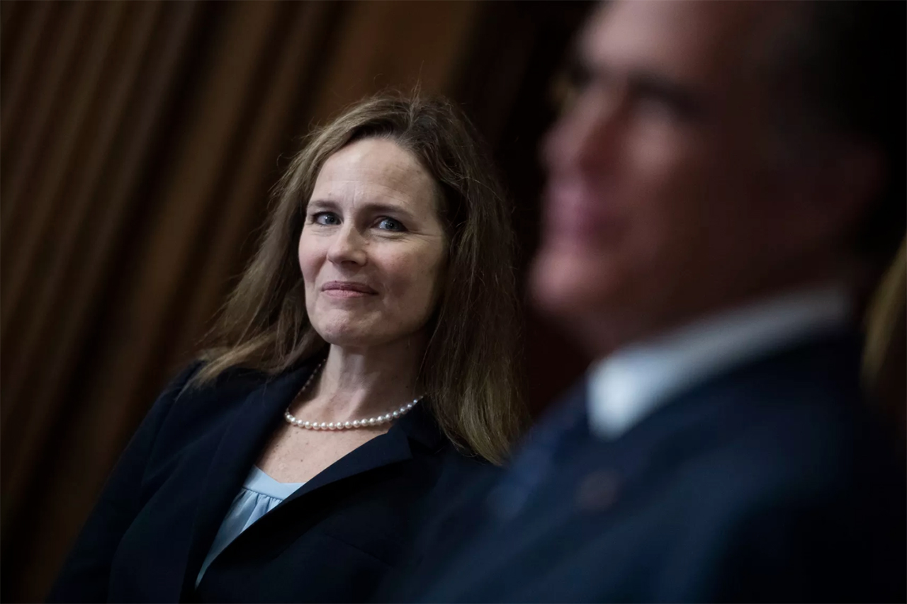 Judge Amy Coney Barrett, President Donald Trumps nominee for the U.S. Supreme Court, meets with Sen. Mitt Romney, R-Utah, on Capitol Hill in Washington on Wednesday, Sept. 30, 2020.