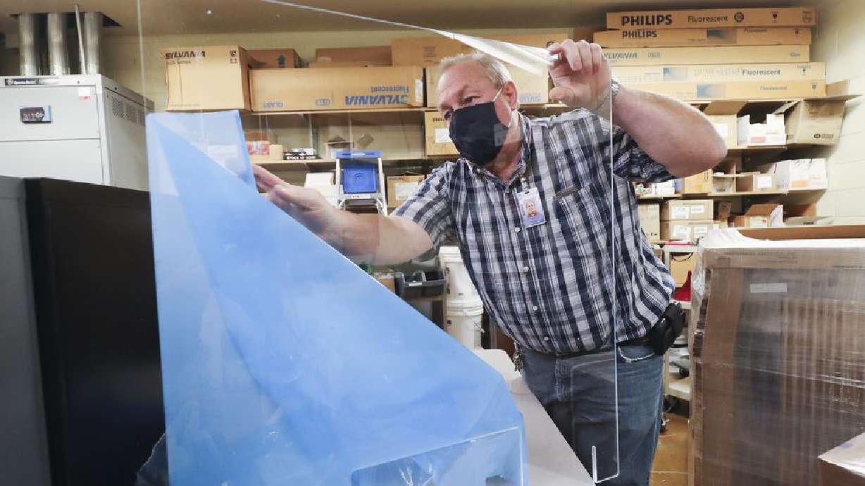 Layton High School facilities coordinator Rod Southam unpacks portable desk shields at the school in Layton on Tuesday, Sept. 29, 2020. Southam is the winner of Utah’s Recognizing Inspirational School Employees (RISE) award, which honors classified school employees who exemplify excellence in work performance, leadership and community involvement. He will be Utah’s nominee for the U.S. Department of Education RISE award.
