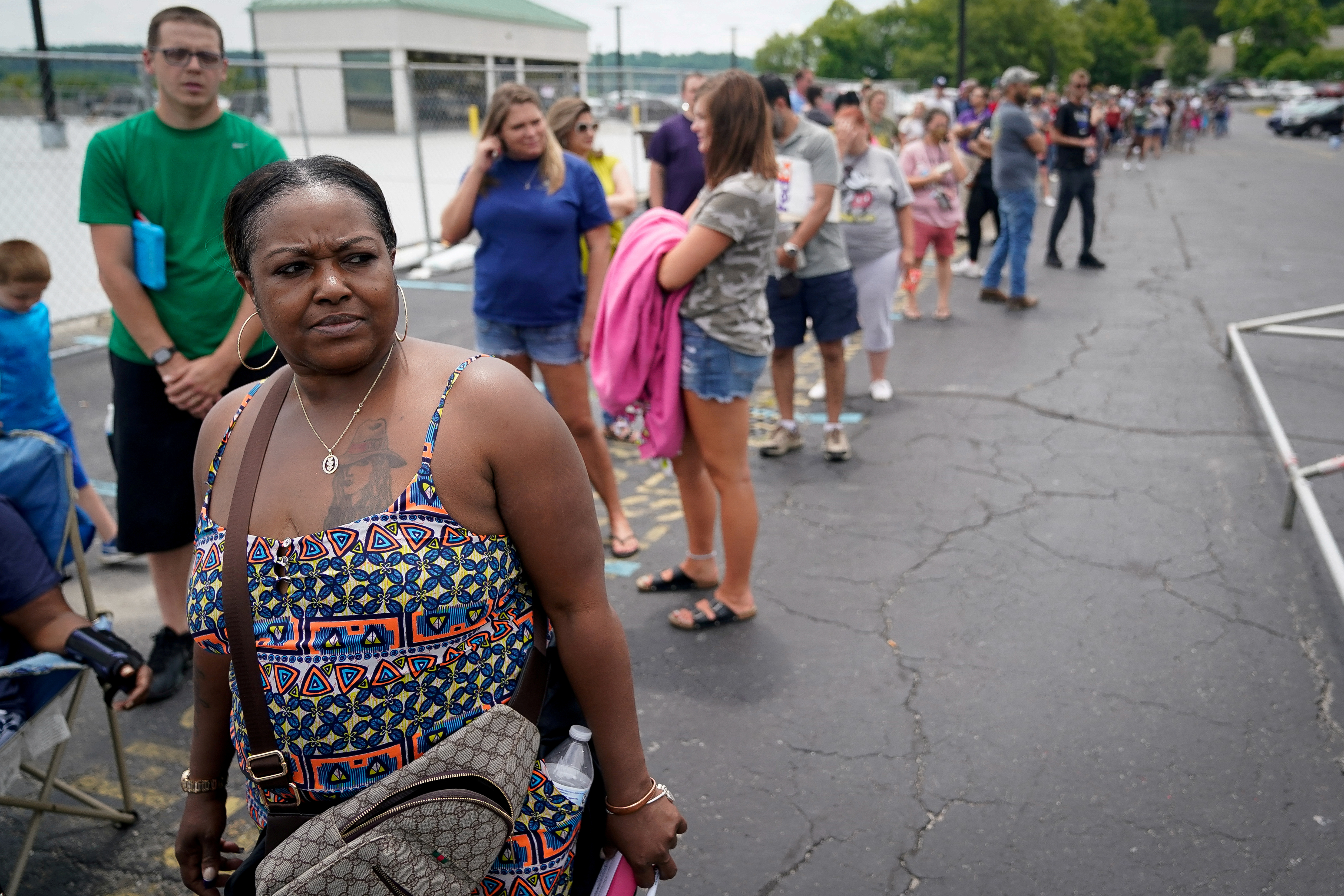 FILE PHOTO: Rose Carter, of Lexington, waits in a line outside a temporary unemployment office established by the Kentucky Labor Cabinet at the State Capitol Annex in Frankfort, Kentucky, U.S. June 17, 2020. REUTERS/
