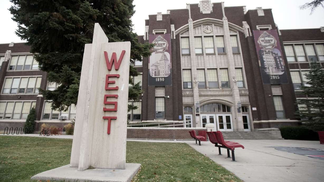 A 16-year-old boy was taken into police custody Wednesday in connection with a shooting that injured a teen in the West High School parking lot.