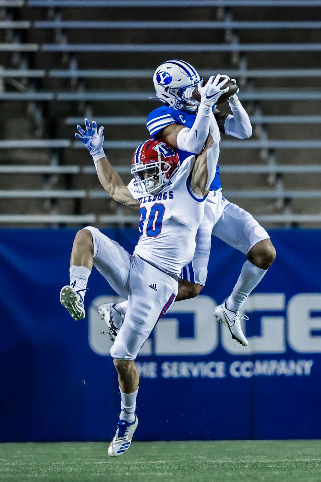 BYU Defensive Back Troy Warner pulls down an interception at LaVell Edwards Stadium in Provo, Utah for their game against Louisiana Tech.
