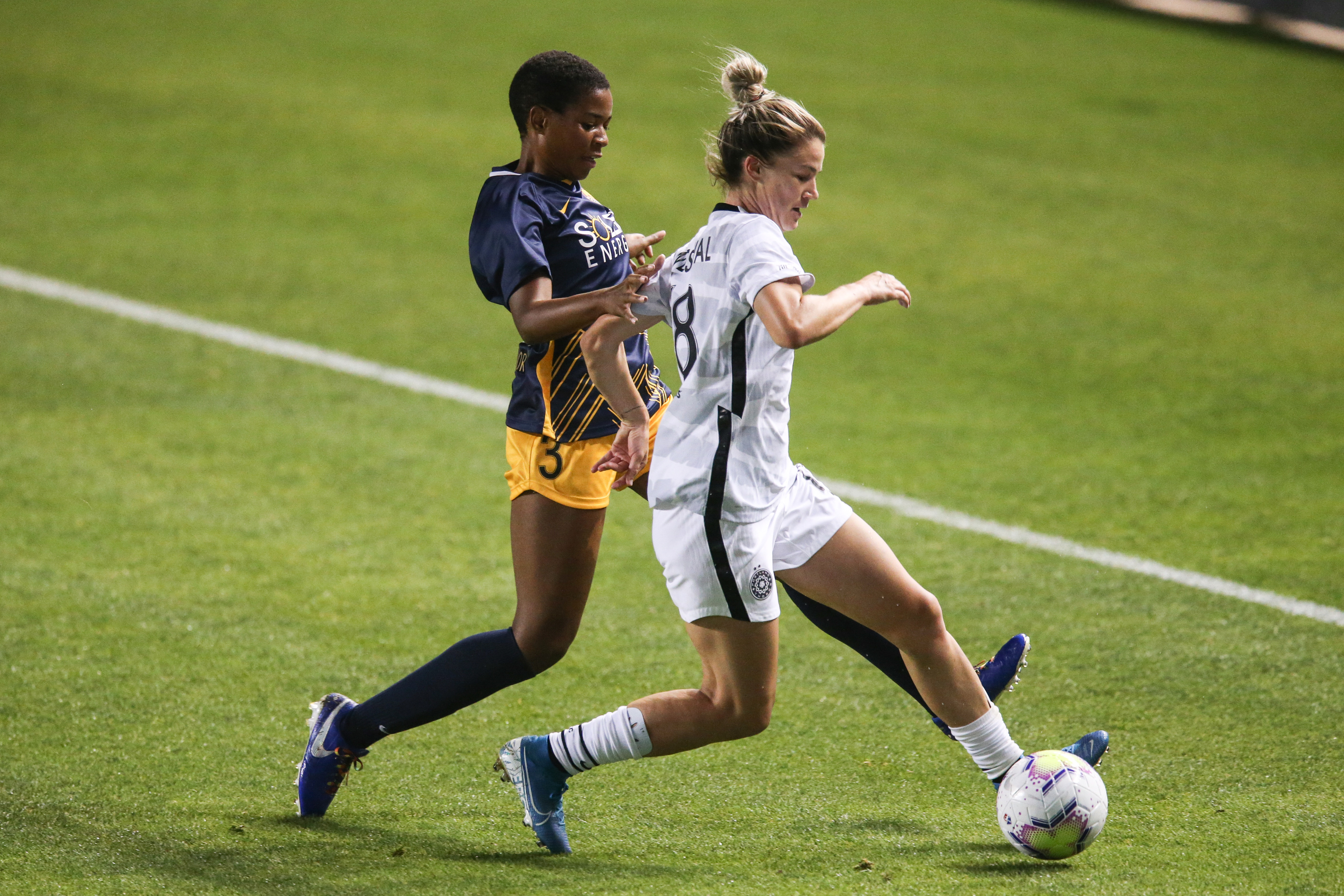 Portland Thorns FC defender Christen Westphal (18) protects the ball against Utah Royals FC forward Tziarra King (3) during a NWSL soccer game at Rio Tinto Stadium in Sandy on Saturday, Oct. 3, 2020.