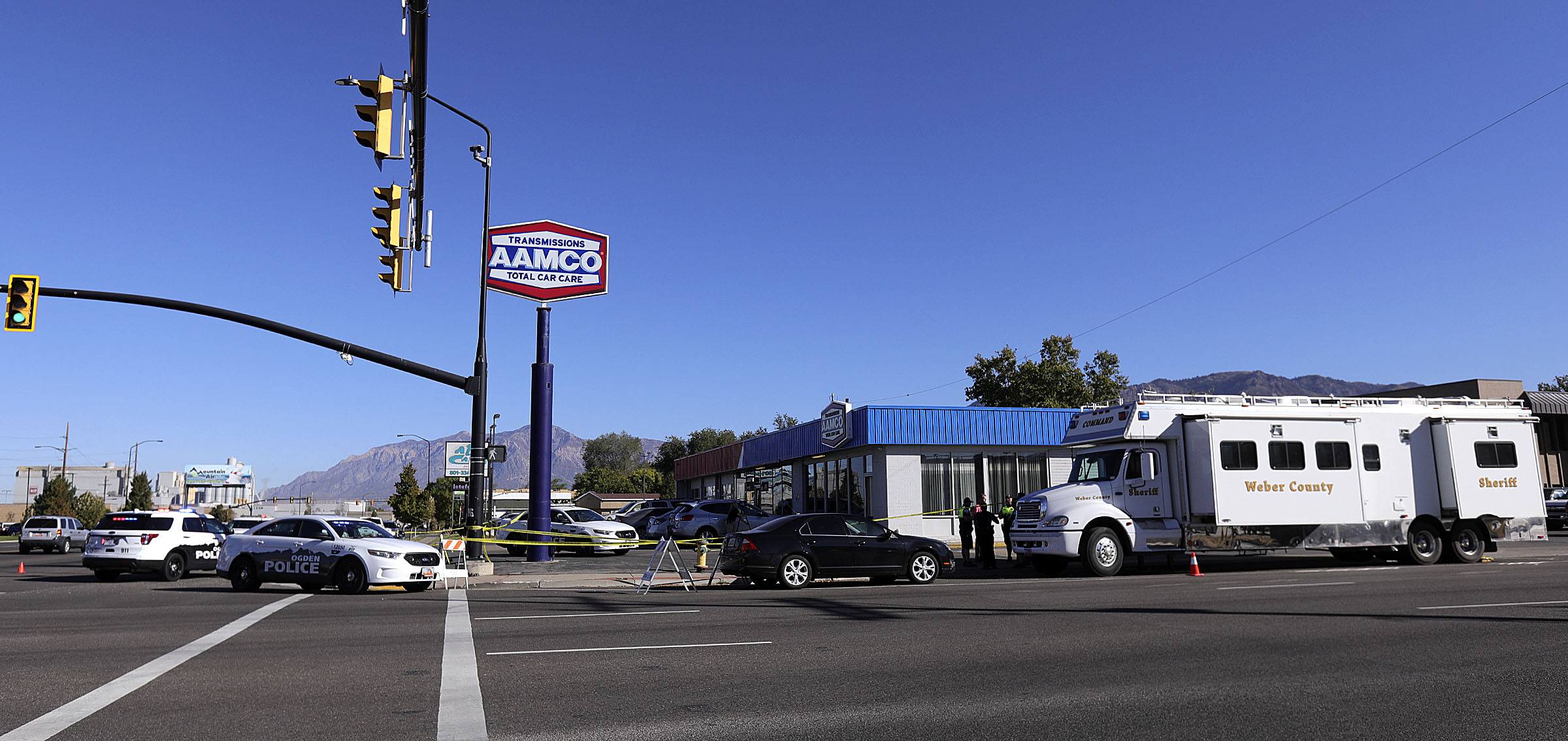 Ogden police, a Weber MetroÂ crime scene investigation unitÂ and a Weber County attorneyâs investigation team work at the scene of an officer-involved shooting at the intersection of 31st Street and Wall Avenue in Ogden on Wednesday, Sept. 30, 2020.