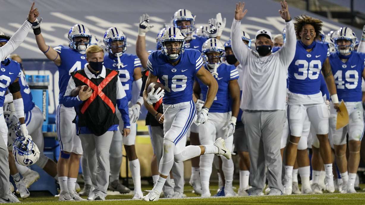 BYU wide receiver Gunner Romney (18) carries the ball against Louisiana Tech during the first half of an NCAA college football game Friday, Oct. 2, 2020, in Provo, Utah.