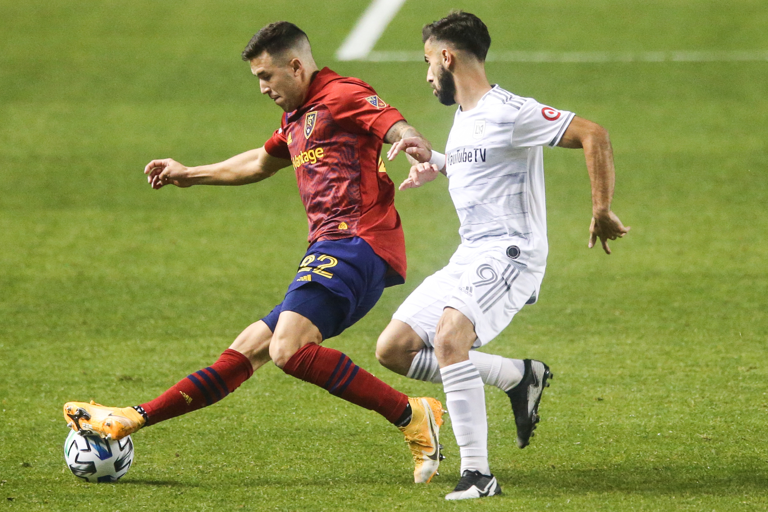 Real Salt Lake defender Aaron Herrera (22) dribbles against Los Angeles FC forward Diego Rossi (9) during a MLS soccer game at Rio Tinto Stadium in Sandy on Sunday, Oct. 4, 2020.