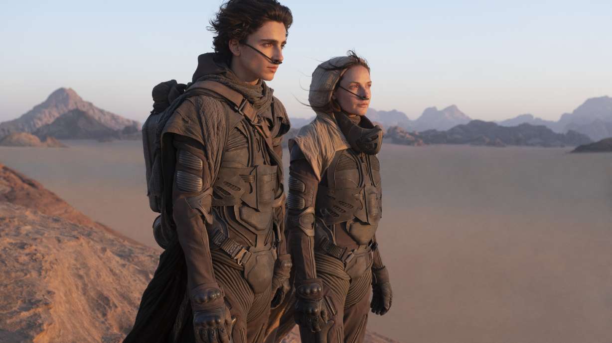 This image released by Warner Bros. Entertainment shows Timothee Chalamet, left, and Rebecca Ferguson in a scene from "Dune."