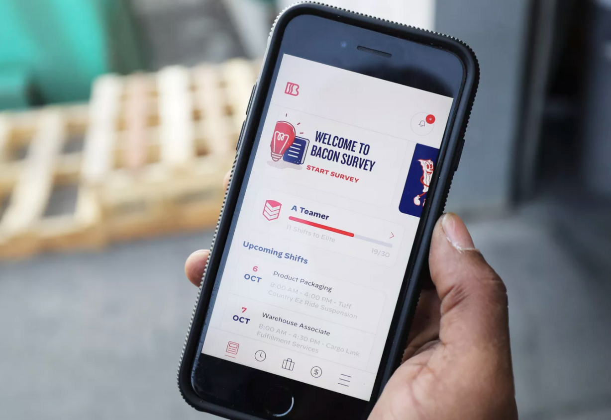 Rashaad Nunnally looks over his upcoming shifts for his temp work in West Jordan on Tuesday, Oct. 6, 2020. Nunnally uses the app Bacon, which connects employers with prequalified on-demand workers similar to a temp agency for the gig economy.