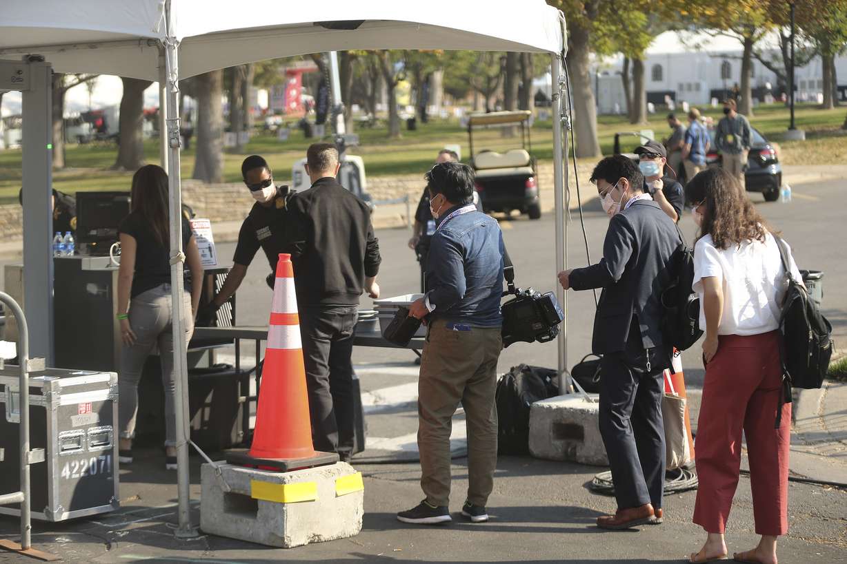 Members of the media go through security at the University of Utah in Salt Lake City on Wednesday, Oct. 7, 2020, prior to the vice presidential debate.