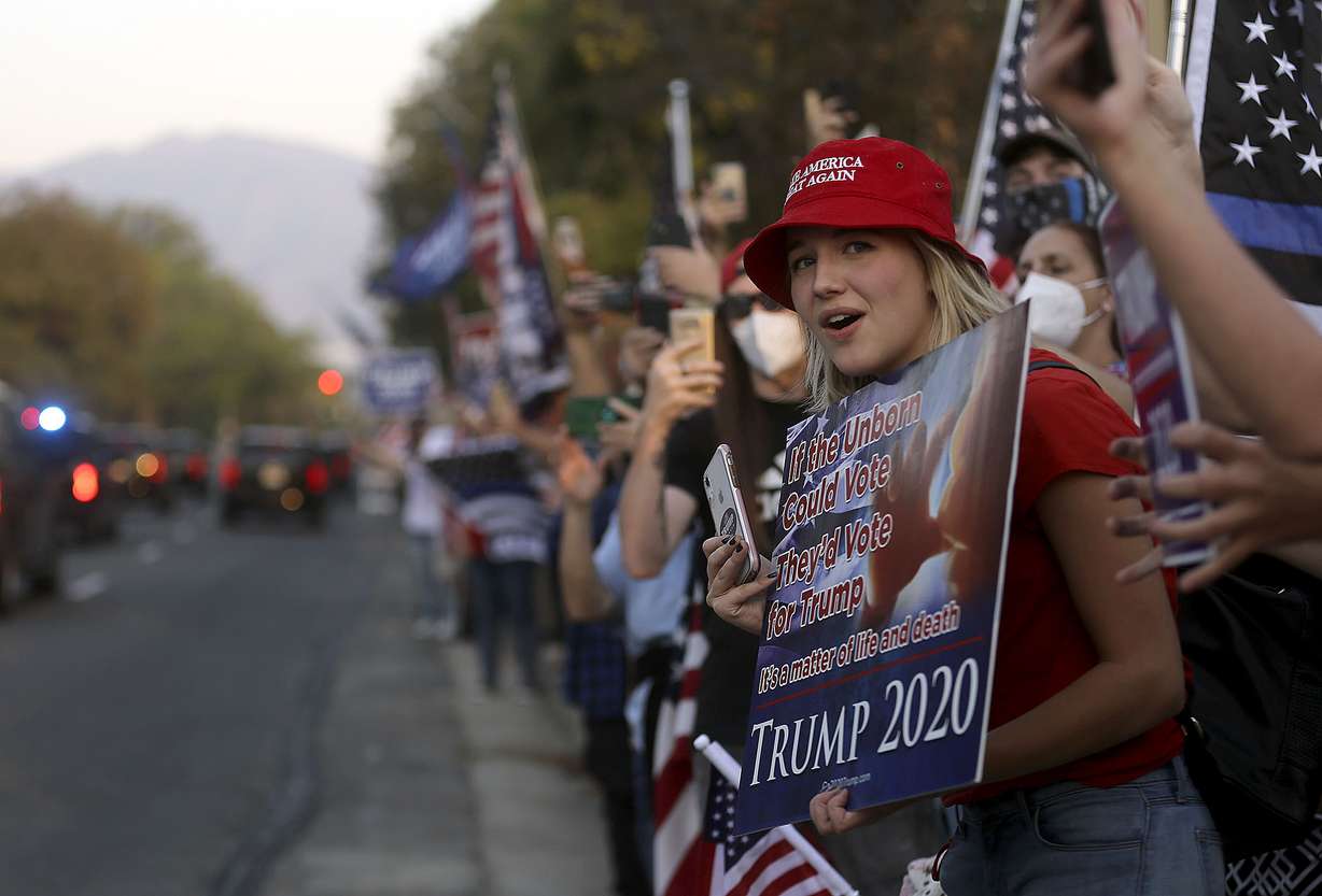Jordan Clinger looks for a motorcade escorting Vice President Mike Pence to Kingsbury Hall for the vice presidential debate in Salt Lake City on Wednesday, Oct. 7, 2020.