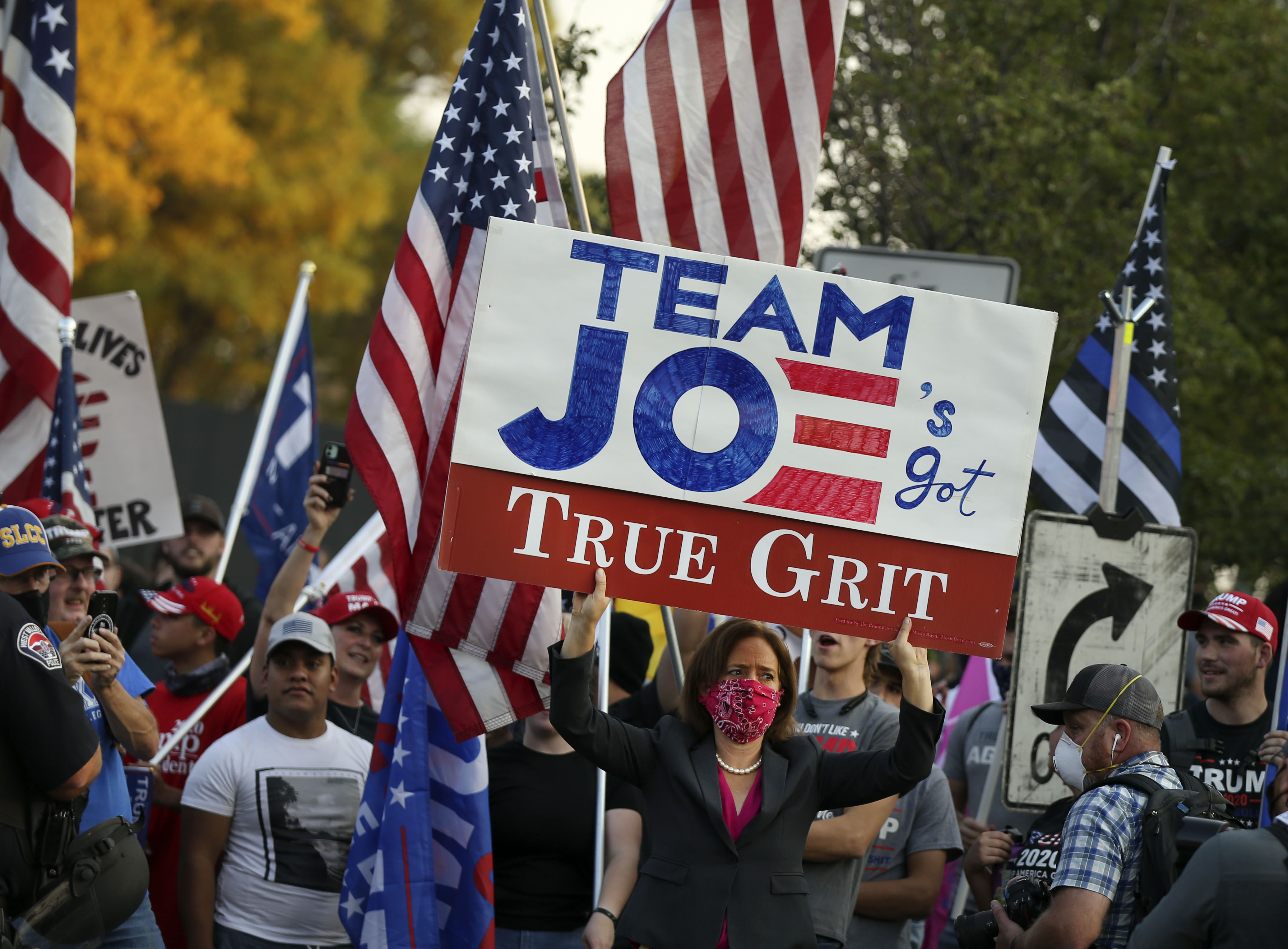 Biden supporter Mosie Boyd battles Trump supporters prior to the vice presidential debate between Vice President Mike Pence and his Democratic rival, California Sen. Kamala Harris, at the University of Utah in Salt Lake City on Wednesday, Oct. 7, 2020.