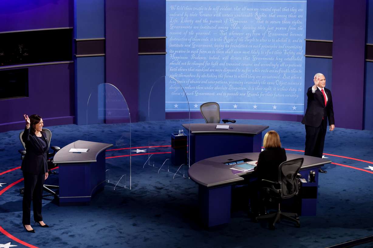 Vice presidential candidates Kamala Harris and Mike Pence take the stage for the vice presidential debate at Kingsbury Hall at the University of Utah in Salt Lake City on Oct. 7, 2020.