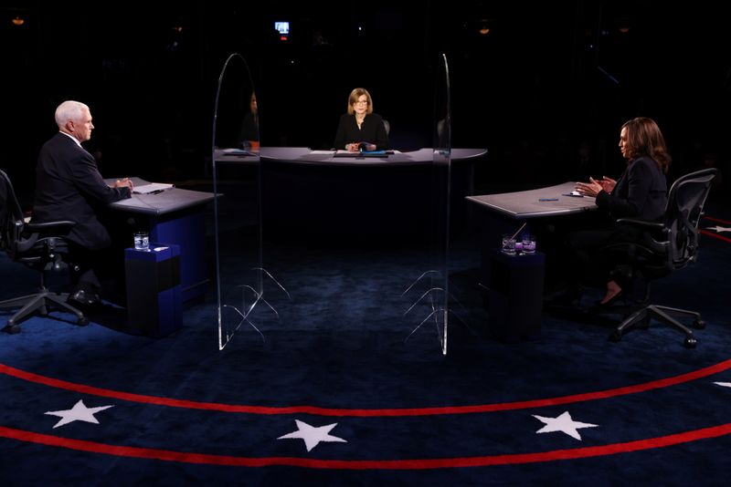 FILE PHOTO: U.S. Vice President Mike Pence and Democratic vice presidential nominee and U.S. Senator Kamala Harris take part in the 2020 vice presidential debate moderated by Susan Page of USA Today, on the campus of the University of Utah in Salt Lake City, Utah, U.S., Oct. 7, 2020. 