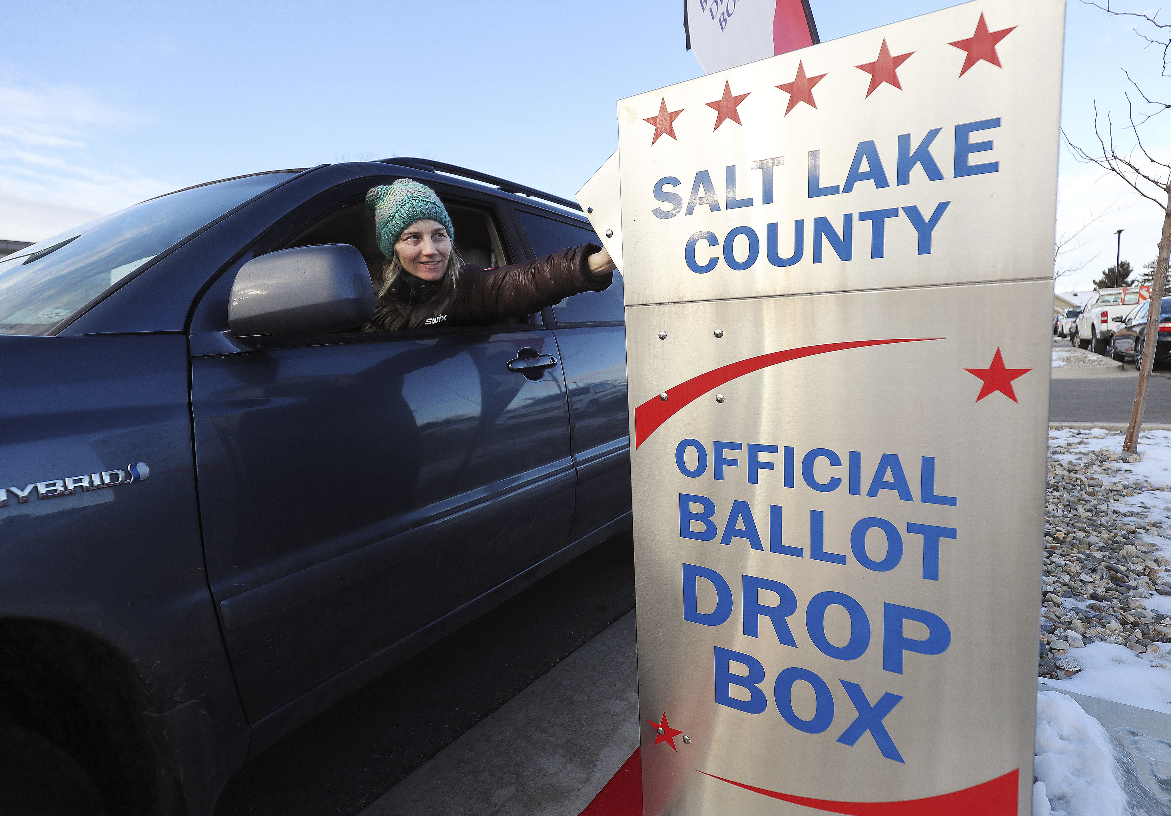 Leslie Tate drops off her ballot  in Cottonwood Heights on Tuesday, March 3, 2020.