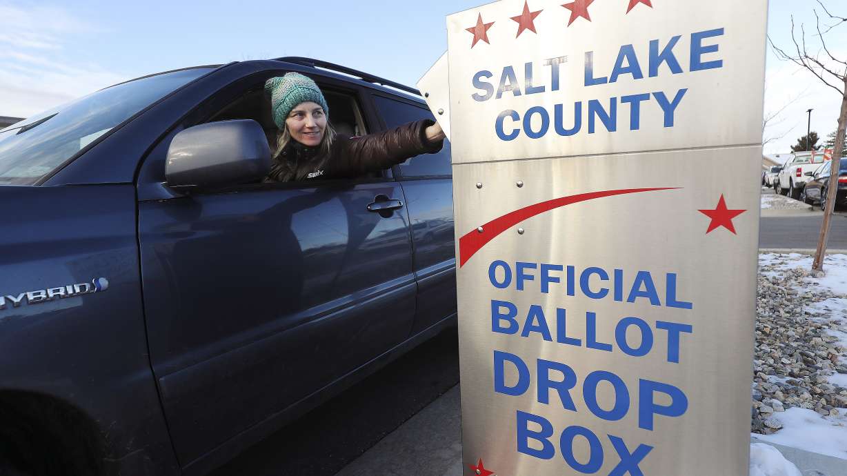Leslie Tate drops off her ballot in Cottonwood Heights on Tuesday, March 3, 2020.