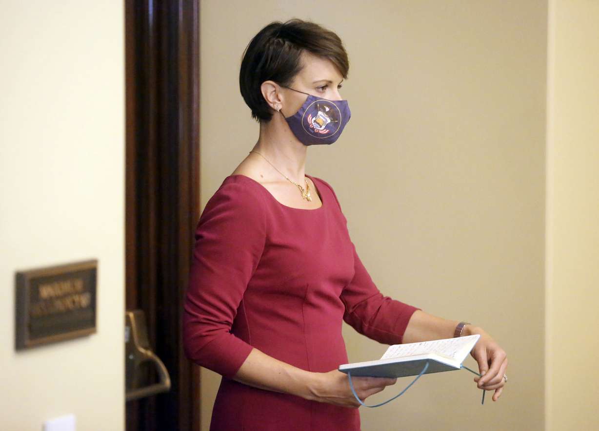 State epidemiologist Dr. Angela Dunn walks to the podium to speak during a COVID-19 press conference at the Capitol in Salt Lake City on Thursday, Oct. 8, 2020.