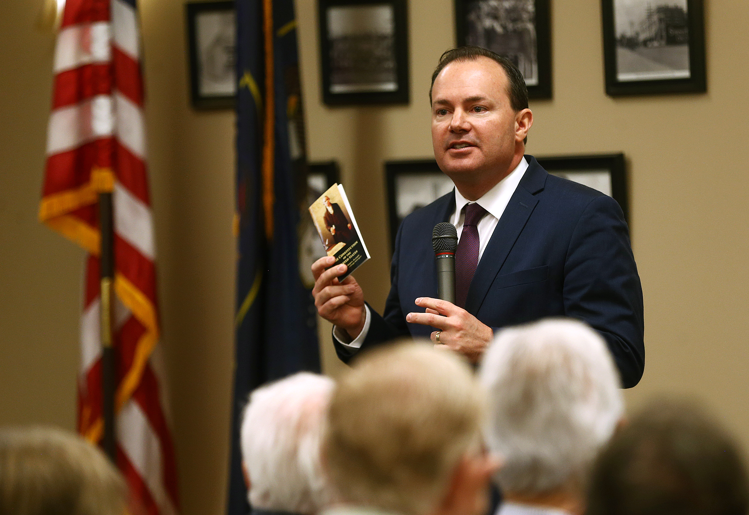 Sen. Mike Lee, R-Utah, holds a copy of the U.S. Constitution as he speaks during a town hall meeting at the Davis County Library in Farmington on Tuesday, Feb. 18, 2020. Sen. Lee answered questions on various topics including health care and the impeachment.
