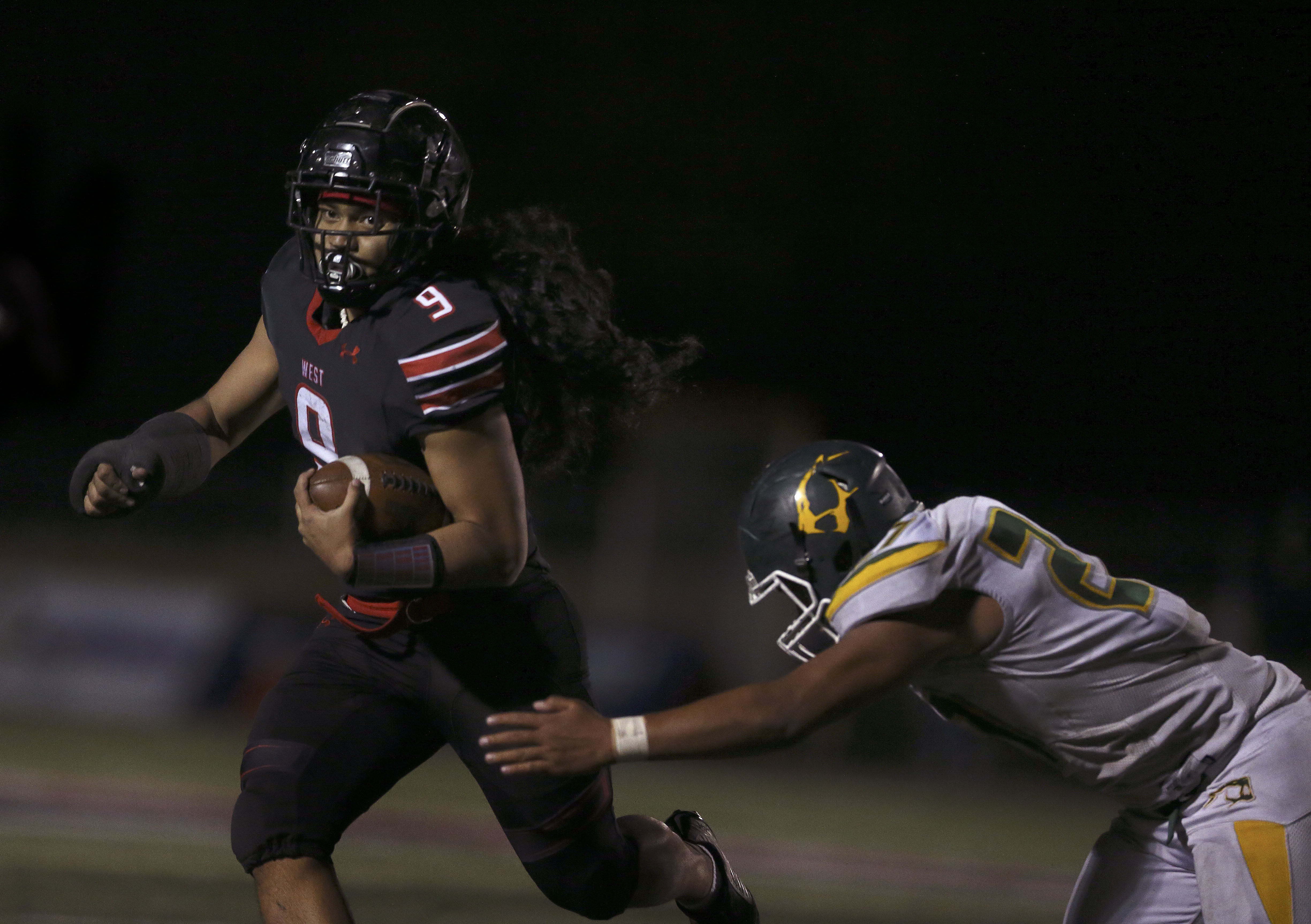 West High and Kearns compete in a high school football game at West High School in Salt Lake City on Friday, Oct. 9, 2020.