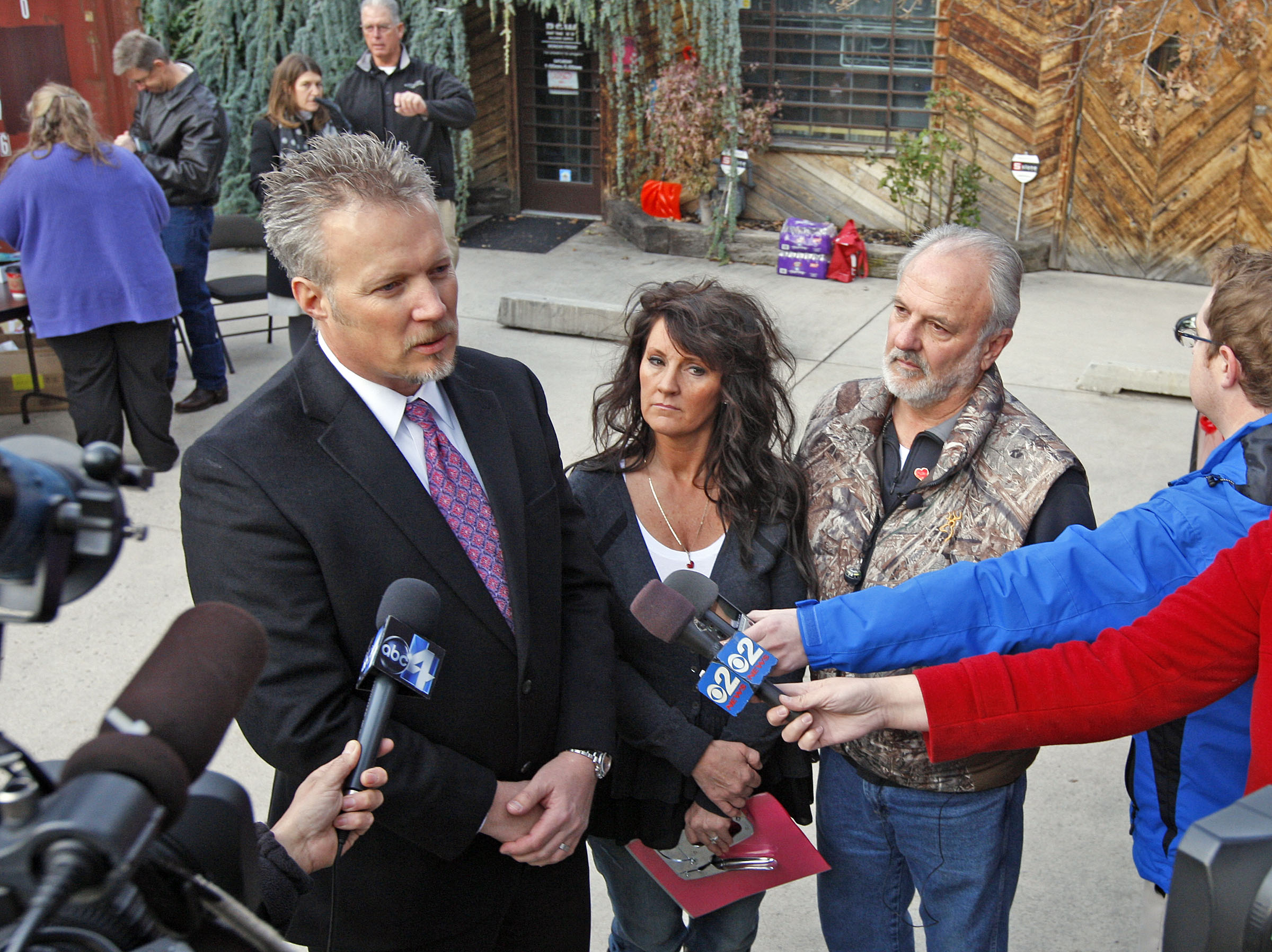 Greg Miller, left, and Heidi Miller speak to reporters on Nov. 30, 2012. The daughter and son-in-law of Sherry Black, whose murder went unsolved for 10 years, are hosting a three-day symposium for law enforcers working cold case homicides.