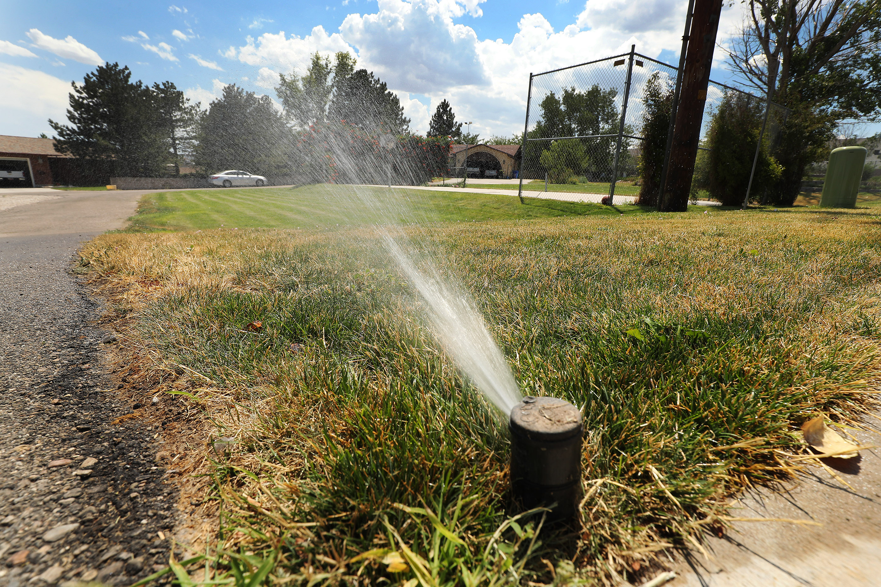 20180725



A lawn is watered in the middle of the day in Riverton on Wednesday, July 25, 2018. Riverton City is asking residents and businesses alike to cut their culinary and secondary water use by 25% due to drought.