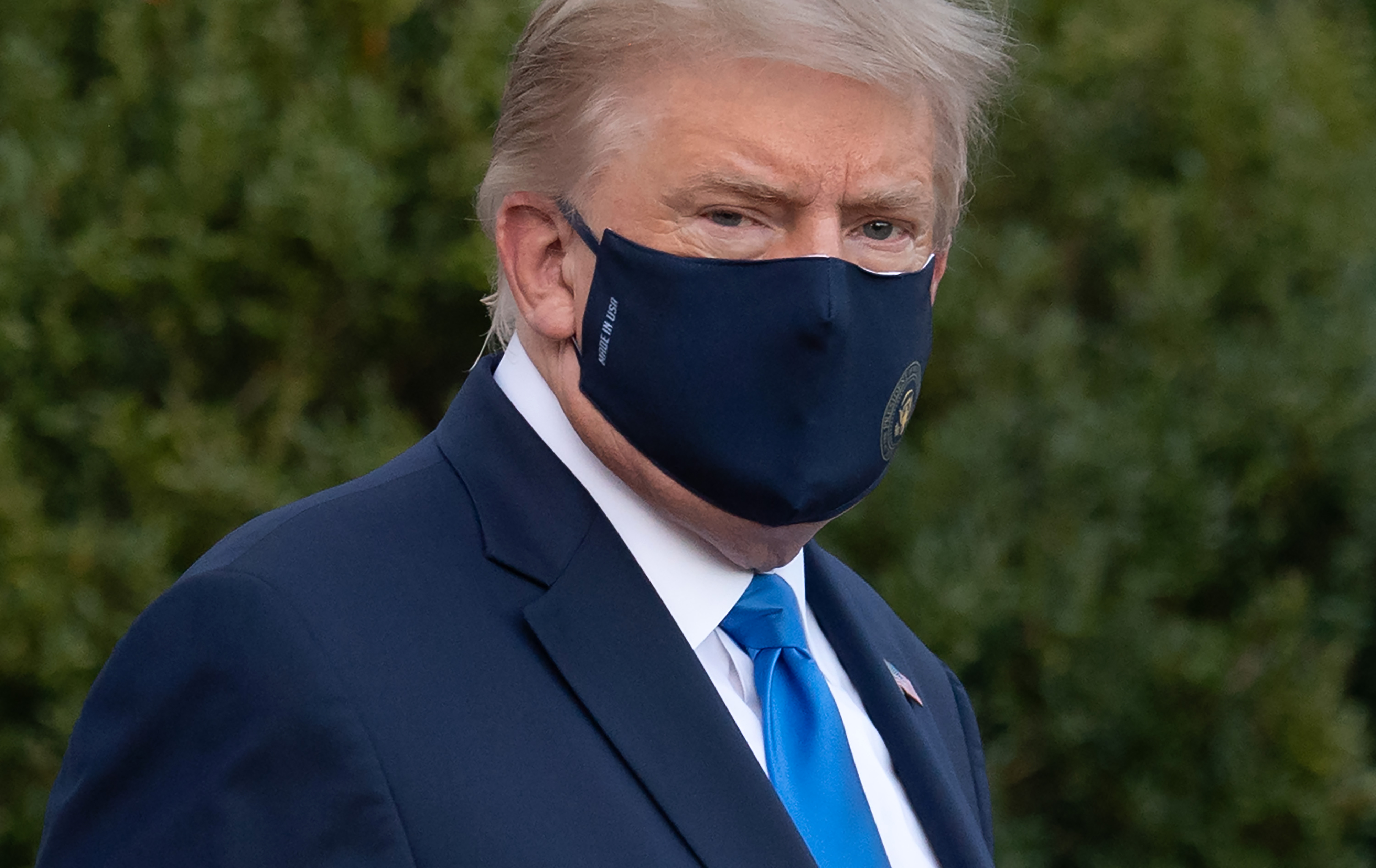 US President Donald Trump walks to Marine One prior to departure from the South Lawn of the White House in Washington, DC, October 2, 2020, as he heads to Walter Reed Military Medical Center, after testing positive for Covid-19. - President Donald Trump will spend the coming days in a military hospital just outside Washington to undergo treatment for the coronavirus, but will continue to work, the White House said Friday