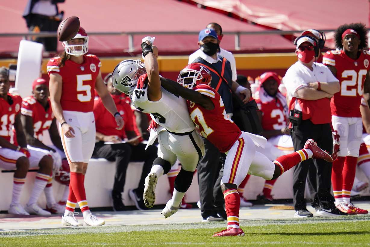 Kansas City Chiefs cornerback Rashad Fenton, right, breaks up a pass intended for Las Vegas Raiders fullback Alec Ingold, left, during the second half of an NFL football game, Sunday, Oct. 11, 2020, in Kansas City.
