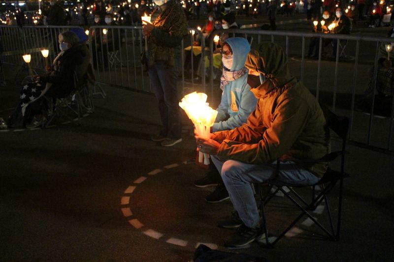 Pilgrims take part in a candlelight vigil during the coronavirus disease (COVID-19) outbreak, at the Catholic shrine of Fatima, Portugal October 12, 2020.  REUTERS/Catarina Demony