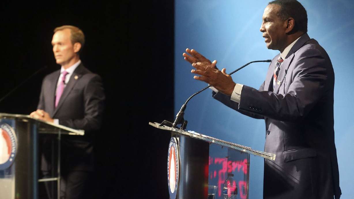 Burgess Owens, 4th Congressional District Republican candidate, participates in a Utah Debate Commission debate with his opponent Rep. Ben McAdams, D-Utah, left, at the Triad Center in Salt Lake City on Monday, Oct. 12, 2020.