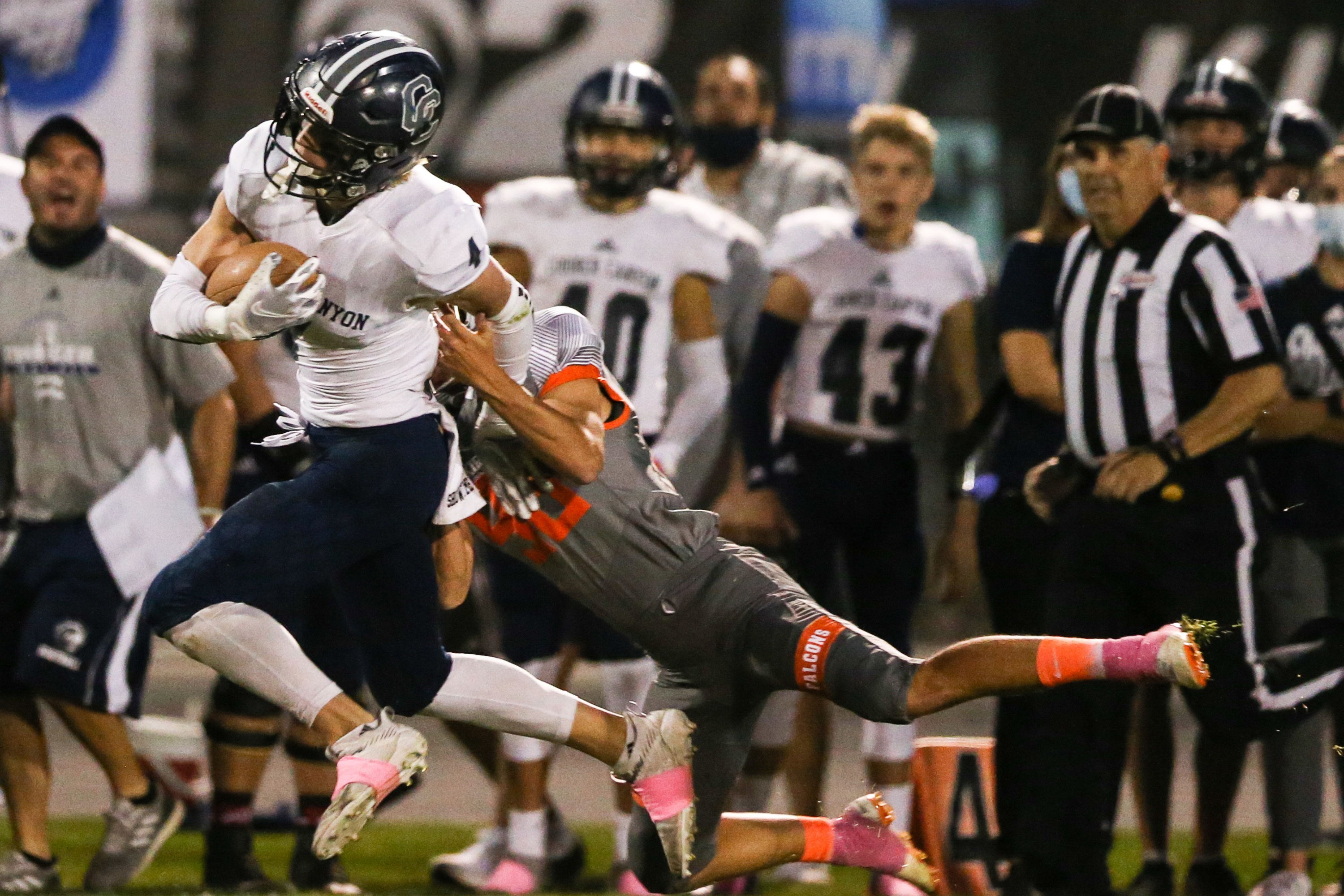 Corner Canyon’s Ryan Cahoon (4) carries the ball for a first down during a high school football game against Skyridge at Skyridge High School in Lehi on Thursday, Oct. 8, 2020.