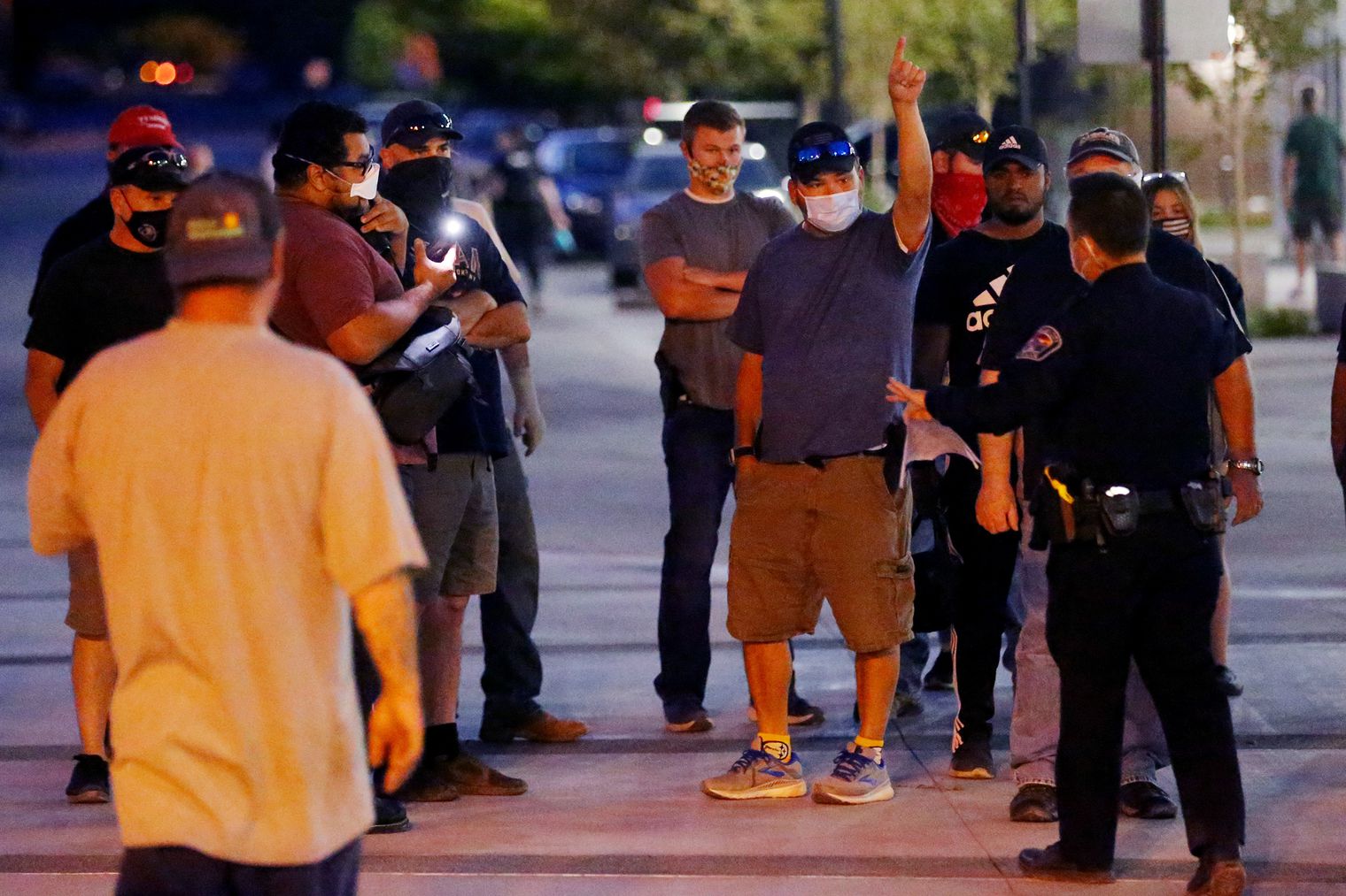 Counterprotesters try to get police to remove a man taking video of them during a demonstration at the West Valley City Police Department on Wednesday, Sept. 16, 2020.