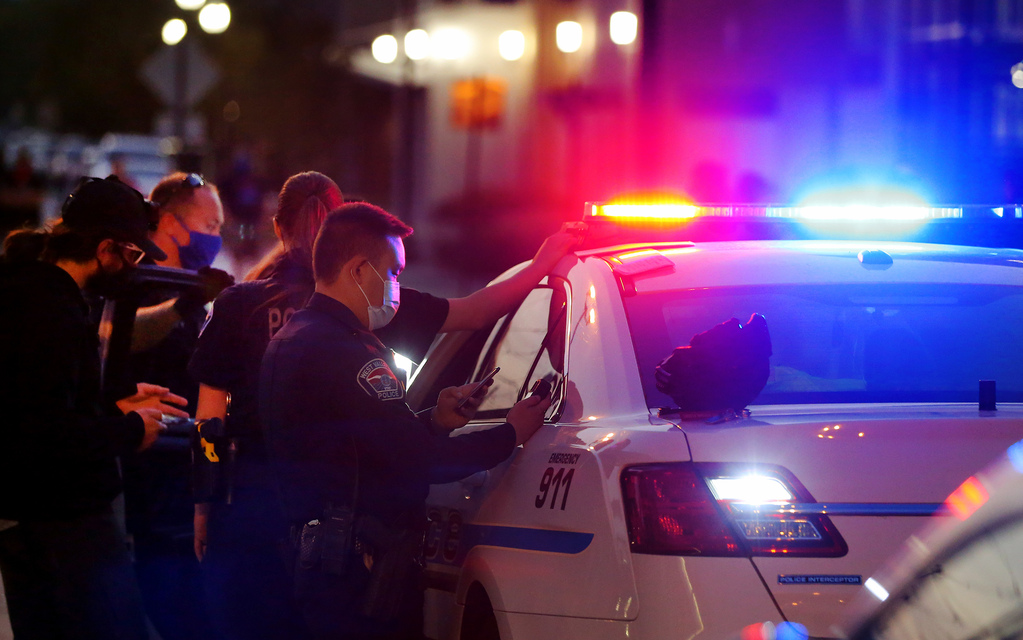 West Valley police officers respond as a protest at the West Valley City Police Department is disrupted by counterprotesters on Sept. 16, 2020. A man pled guilty on Tuesday to hitting Black Lives Matter protesters with pepper spray at the demonstration.