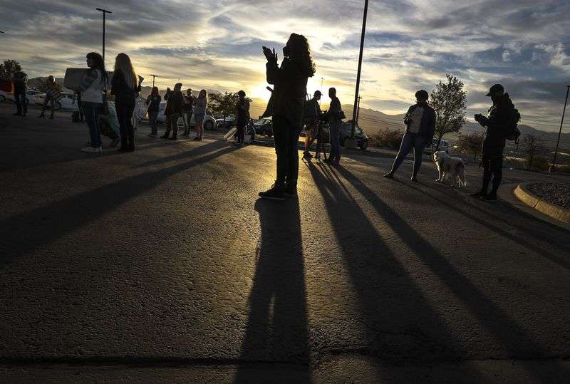 Beth Thompson, center, whose husband is incarcerated in the Utah Department of Corrections’ prison system, joined other families as they voiced their concerns about the department’s handling of the COVID-19 outbreak during a rally outside the Department of Corrections office in Draper on Tuesday, Oct. 13, 2020.