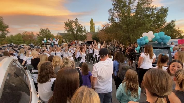 Hundreds of people flock to a Syracuse neighborhood Tuesday, Oct. 13, 2020 to welcome home a teen who was severely injured earlier this summer in a head-on crash with a suspected DUI driver.